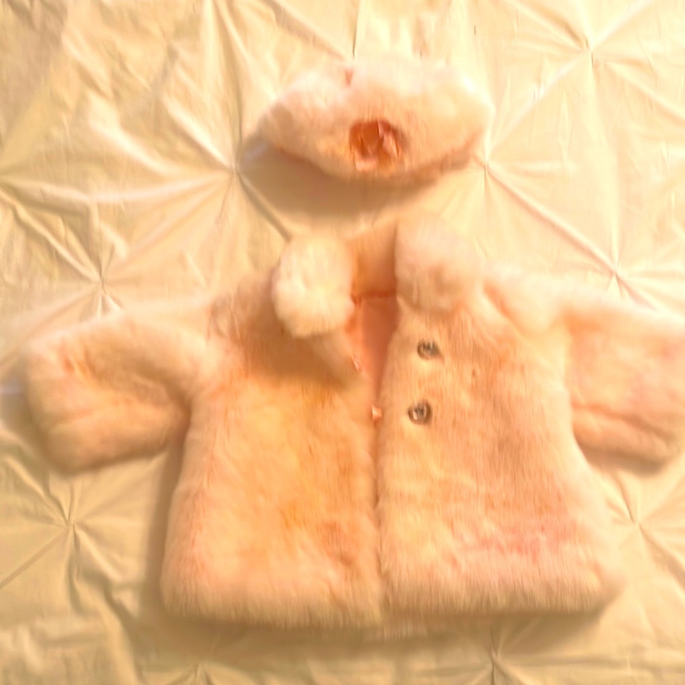 Adorable pink faux fur coat with matching hat. Pink jeweled button 12 mos.